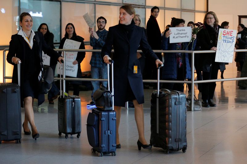 Opponents of US President Donald Trump's executive order travel ban greet members of a Lufthansa flight crew atu00c2u00a0Loganu00c2u00a0Airportu00c2u00a0in Boston February 3, 2017.u00c2u00a0u00e2u20acu201d Reuters pic
