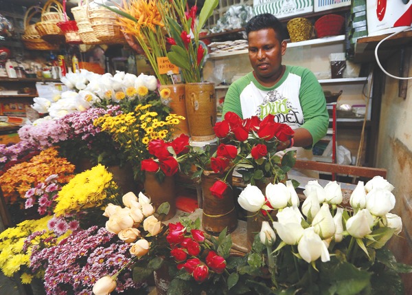 Roses galore and Satchiathanandhan is left wondering what lies ahead with the price increase. u00e2u20acu201d Picture by Farhan Najib 