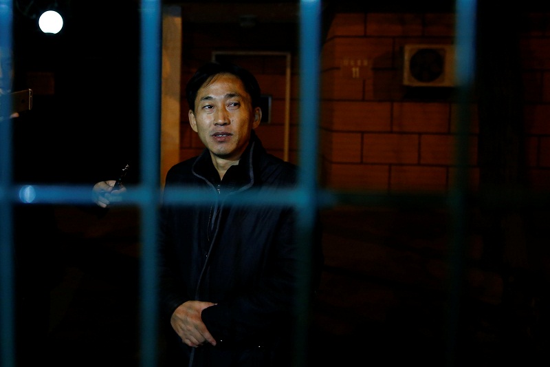 North Korean national Ri Jong-chol stands behind the fence of the North Korean embassy compound in Beijing March 4, 2017. u00e2u20acu201d Reuters pic
