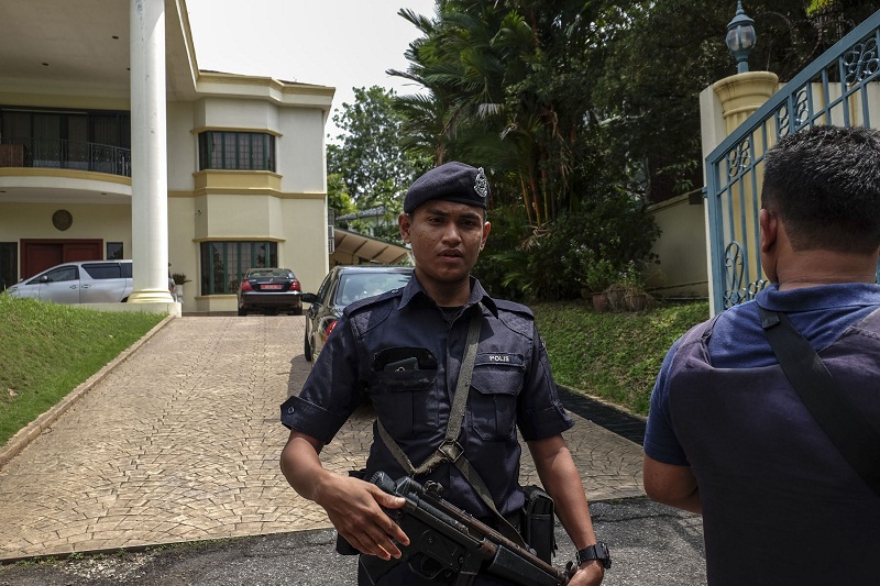 Malaysian police stand guard in front of the North Korean embassy in Damansara Heights, Kuala Lumpur after the government imposed a ban on its diplomats from leaving the country on March 7, 2017. u00e2u20acu201d Picture by Yusof Mat Isa