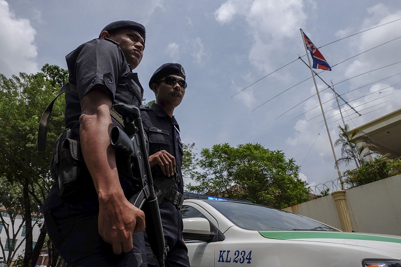 Malaysian police stand guard in front of the North Korean embassy in Damansara Heights, Kuala Lumpur after the government imposed a ban on its diplomats from leaving the country on March 7, 2017.