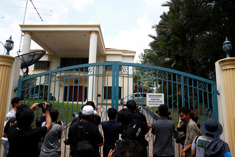 Journalists crowd around the gate as an embassy car leaves the North Korean embassy in Kuala Lumpur March 8, 2017. u00e2u20acu201d Reuters pic