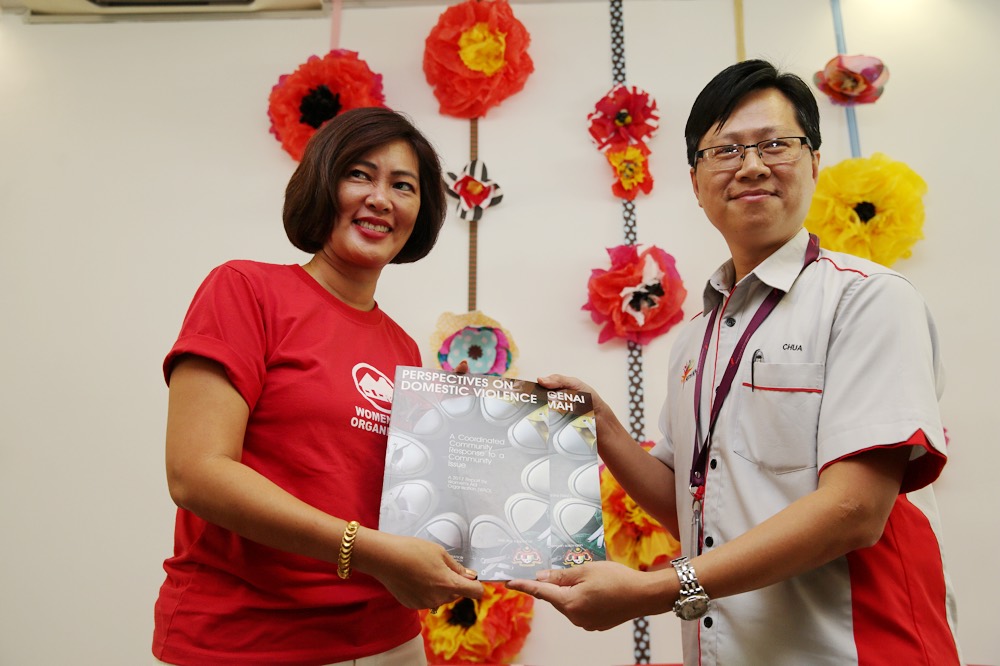 Women’s Aid Organisation (WAO) president Carol Chin (left) and the Women, Family and Community Development policy division acting undersecretary Chua Choon Hwa with the WAO’s 2017 report in Kuala Lumpur March 8, 2017. — Picture by Choo Choy May