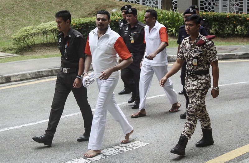 N. Pathmanabhan (second from right) and T. Thilaiyalagan (second from left) are led to the Federal Court in Putrajaya March 16, 2017. — Bernama pic