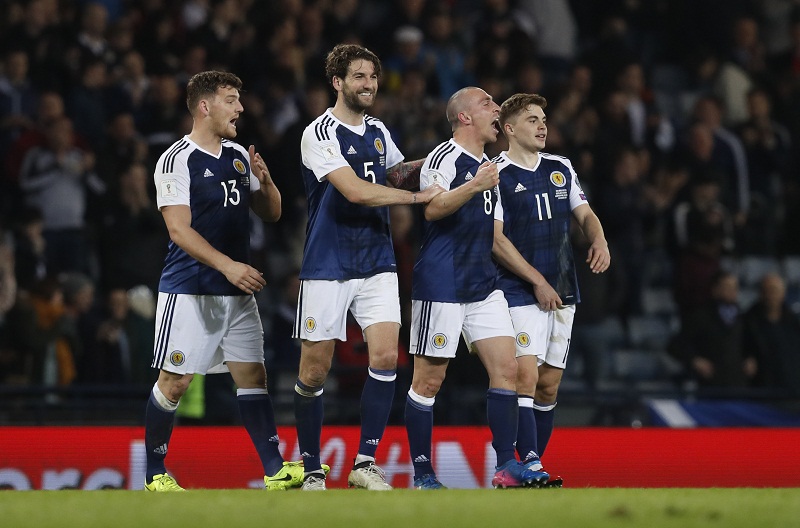Scotland's Chris Martin, Charlie Mulgrew, Scott Brown and James Forrest celebrate after the 2018 World Cup Qualifying European Zone match against Slovenia at the Hampden Park, Glasgow March 26, 2017. u00e2u20acu201d Reuters pic