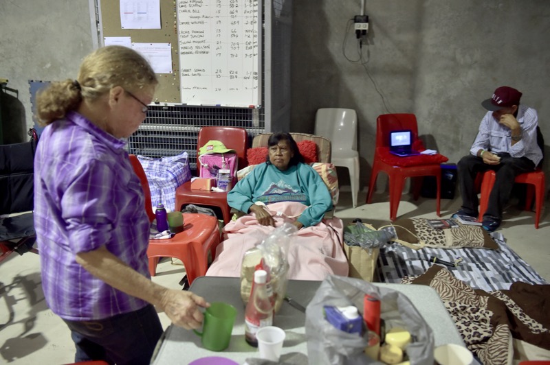 A family relaxes in a temporary cyclone shelter in the town of Ayr in far north Queensland as Cyclone Debbie approaches on March 28, 2017. u00e2u20acu201d AFP pic
