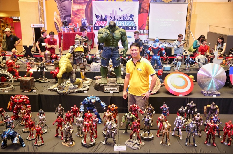 Tang Kok Weng poses with some of his personall figure collection at the Toy Collectors Exhibition. u00e2u20acu201d Picture by Saw Siow Feng