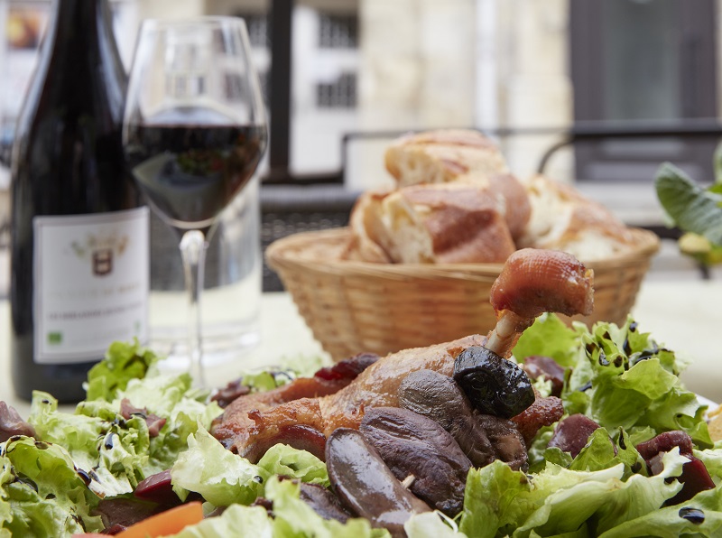 The duck breast salad at the Cafe Des Sports in Lectoure, a picturesque hilltop town in France’s Gascony region, March 6, 2017. The high-ceilinged, slightly gone-to-seed establishment is festooned with rugby ephemera — the sport being as sacred to Gascons as duck fat. — Picture by Andy Haslam/The New York Times