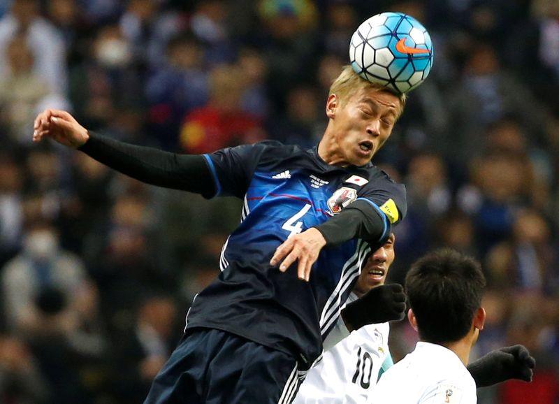 Japanu00e2u20acu2122s Keisuke Honda and Thailandu00e2u20acu2122s Teerasil Dangda in action during their World Cup 2018 Qualifier in Saitama, Japan, March 28, 2017. u00e2u20acu201d Reuters pic