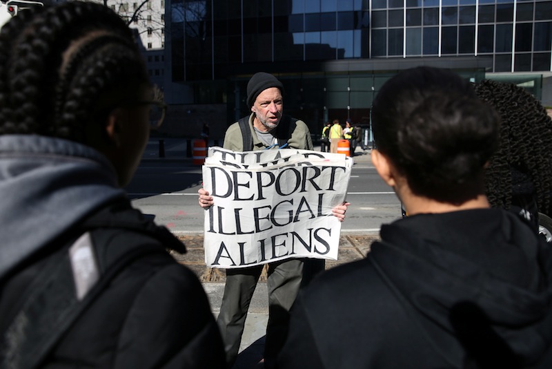 Jim McDonald holds a sign as supporters demonstrate in support of immigration activist Ravi Ragbir (unseen) in New York, March 9, 2017. u00e2u20acu201d Reuters pic 
