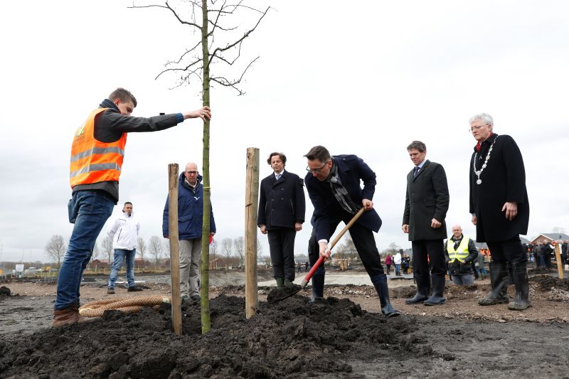 Dutch minister of Foreign affairs Bert Koenders, Malaysiau00e2u20acu2122s Ambassador Ahmad Nazri Yusof and Tan Sri Mohamad Nor Yusof, chairman of Malaysia Airlines, plant trees for the national monument in memory of the victims of the victims of the flight MH17 in Vi