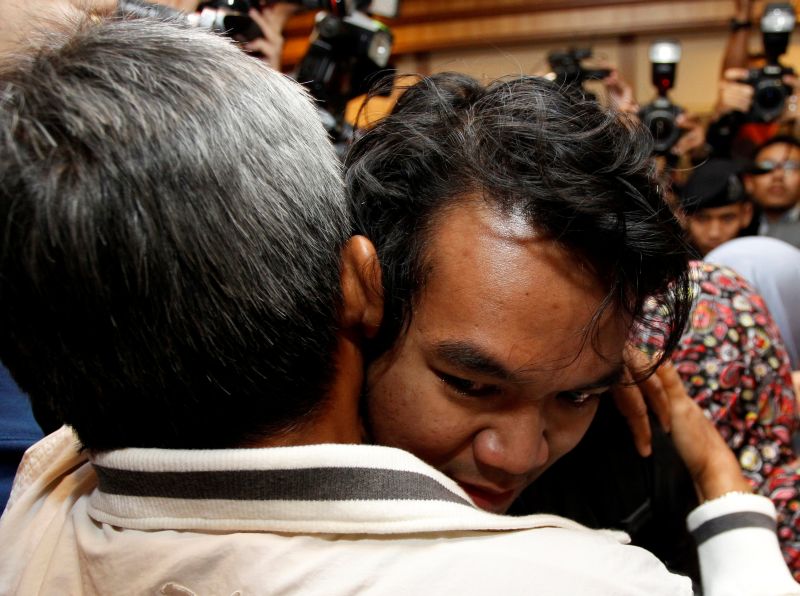 Mohd Radzuan Othman, one of the nine Malaysians who were previously stranded in Pyongyang hugs a family member at the Kuala Lumpur International Airport in Sepang March 31, 2017. u00e2u20acu2022 Reuters pic