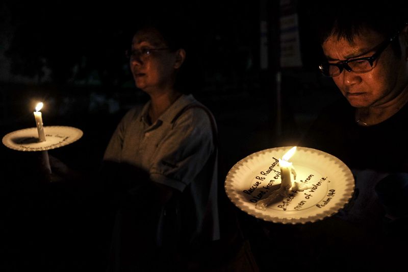A candlelight vigil for missing Pastor Raymond Koh is held outside the Selangor police headquarters in Shah Alam, March 5, 2017. u00e2u20acu201d Picture by Yusof Mat Isa