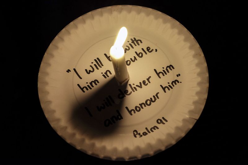A candlelight vigil for missing Pastor Raymond Koh is held outside the Selangor police headquarters in Shah Alam, March 5, 2017. u00e2u20acu201d Picture by Yusof Mat Isa
