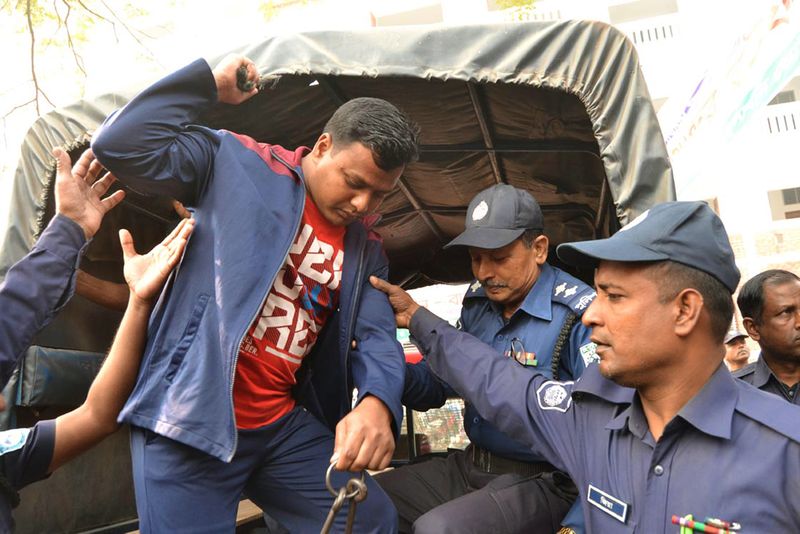 A convicted Islamist militant being escorted by Bangladesh police outside a court in Rangpur on February 28, 2017. u00e2u20acu201d AFP pic