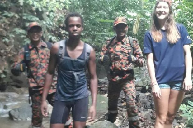 The two missing students Nyamu Wanyolke and Katie Clubb with the members of the Fire and Rescue department in the Star Online screen grab.