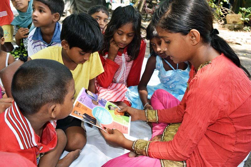 Children read an anti-trafficking comic in Birnagar Village, West Bengal March 9, 2017. u00e2u20acu201d Reuters pic