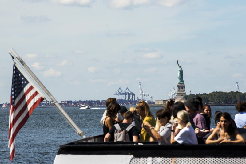 A boatload of tourists stand on a boat as it departs from Battery Park in New York August 27, 2015. u00e2u20acu201d Reuters pic