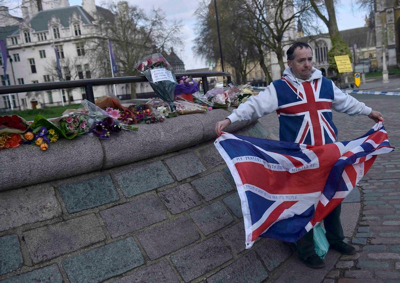 Armed British police use stun gun on man inside grounds of parliament ...