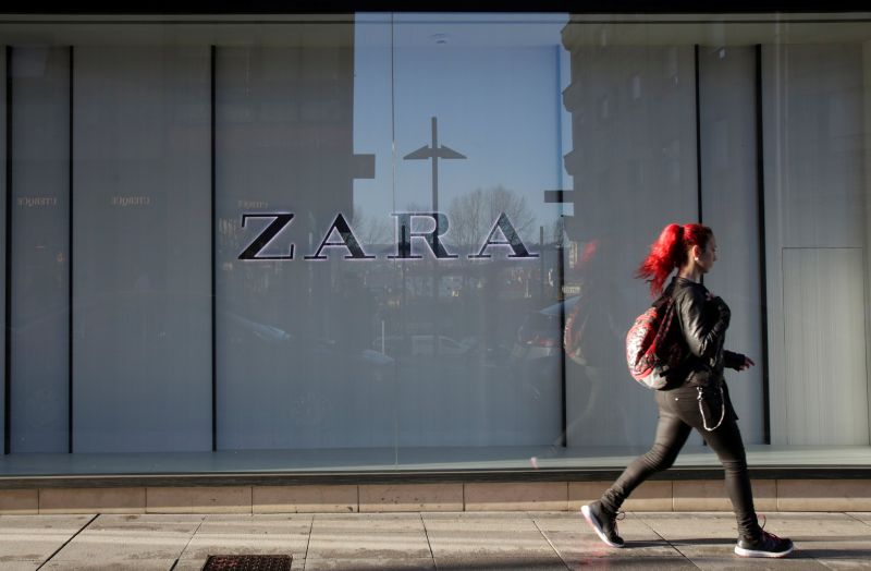 A woman walks past the window of a store of Inditex's main brand Zara in Pontevedra, Spain March 15, 2017. u00e2u20acu201d Reuters pic