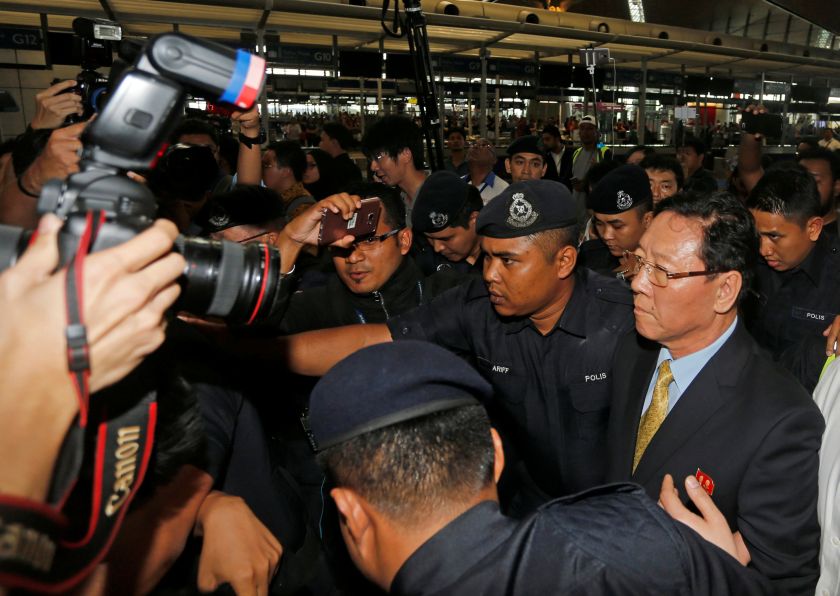 North Korean ambassador Kang Chol (right), who was expelled from Malaysia, is escorted as he arrives at Kuala Lumpur International Airport in Sepang March 6, 2017. u00e2u20acu201d Reuters pic