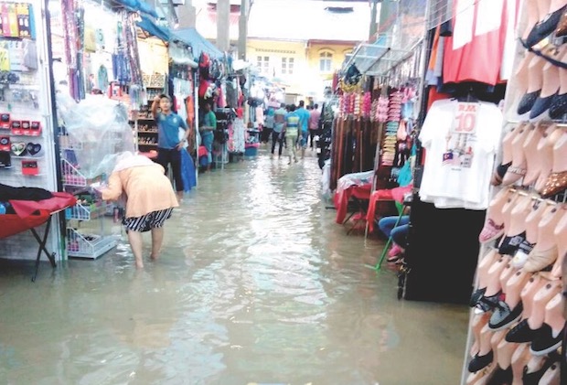The flooded bazaar in Jalan Masjid India after the Klang River burst its banks yesterday. u00e2u20acu201d Picture by Fire and Rescue Department