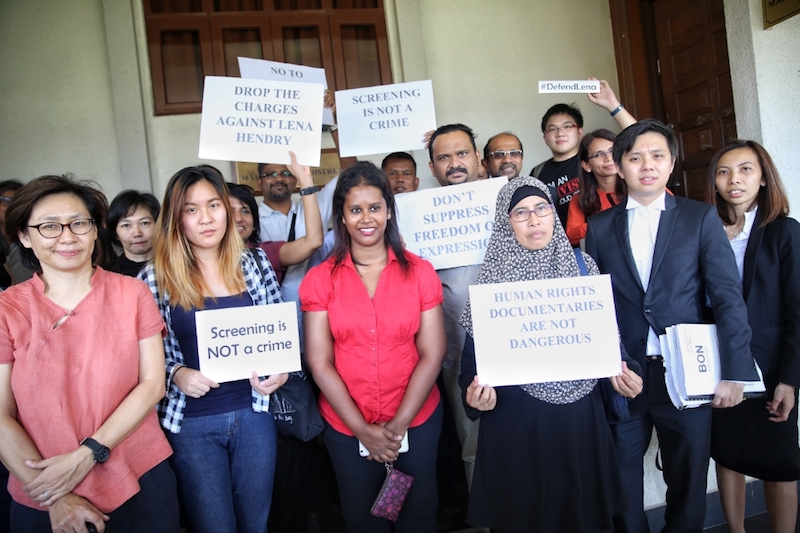 Activist Lena Hendry (in red) is seen at the Magistrateu00e2u20acu2122s Court in Kuala Lumpur March 22, 2017. u00e2u20acu201d Picture by Saw Siow Feng