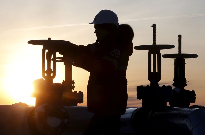 A worker checks the valve of an oil pipe at the Lukoil owned Imilorskoye oil field near Kogalym, Russia January 25, 2016. u00e2u20acu201d Reuters pic