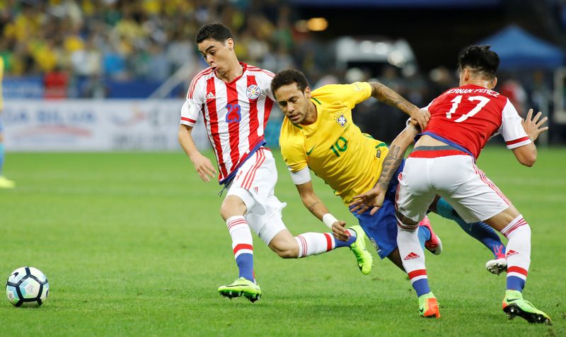 Brazil's Neymar (centre) in World Cup qualifying action against Paraguay's Miguel Almiron (left) and Hernan Perez in Sao Paulo March 28, 2017. u00e2u20acu201d Reuters pic