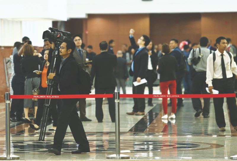 Members of the media are not allowed to cross the red tape and into the lobby in Parliament. u00e2u20acu201d Picture by Azneal Ishak