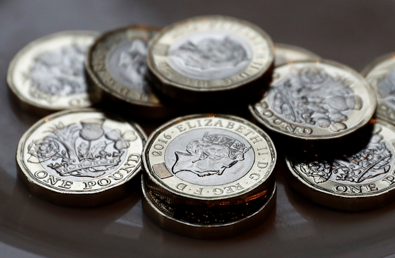 New one pound coins which comes into circulation today, are seen in Liverpool March 28, 2017. u00e2u20acu201d Reuters pic
