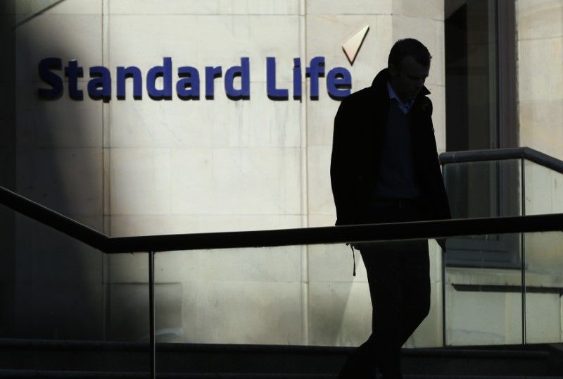 A worker leaves the Standard Life House in Edinburgh February 27, 2014. u00e2u20acu201d Reuters pic