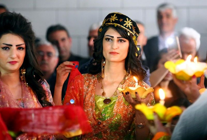 Syrian-Kurdish women model traditional Kurdish attire during a fashion show in the northeastern Syrian city of Qamishli which coincides with the Day of Kurdish Clothing. u00e2u20acu2022 AFP pic