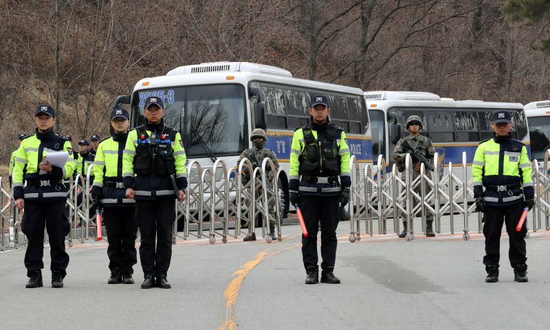 South Korean policemen and soldiers stand guard at a golf course owned by Lotte, where the U.S. Terminal High Altitude Area Defense (THAAD) system will be deployed, in Seongju, South Korea, March 1, 2017. u00e2u20acu201d Reuters pic