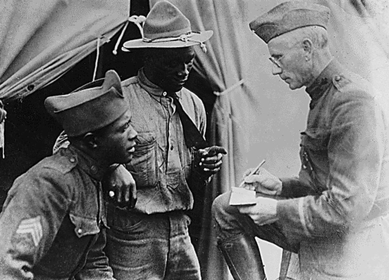This file photo from The National Archives taken in September 1918 during World War I, at Camp Hospital Number 43, shows Lieutenant John Applebee (right), an American Red Cross Home Service worker, as he gives comfort and reassurance to American soldiers. ― AFP pic
