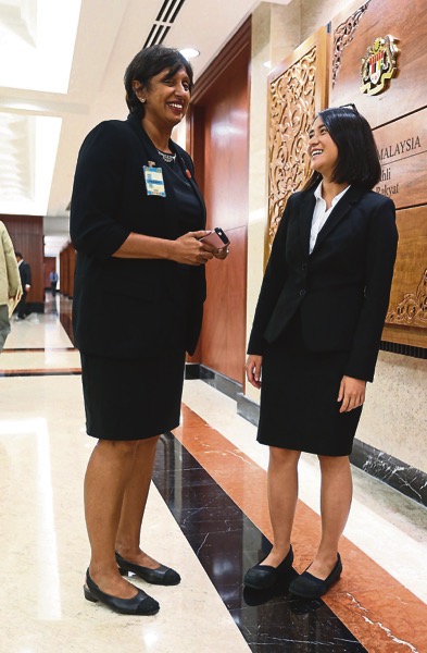 Meera (left) and Tan had to fight their way into Parliament yesterday after security personnel deemed their skirts were too short. u00e2u20acu201d Picture by Razak Ghazali. 