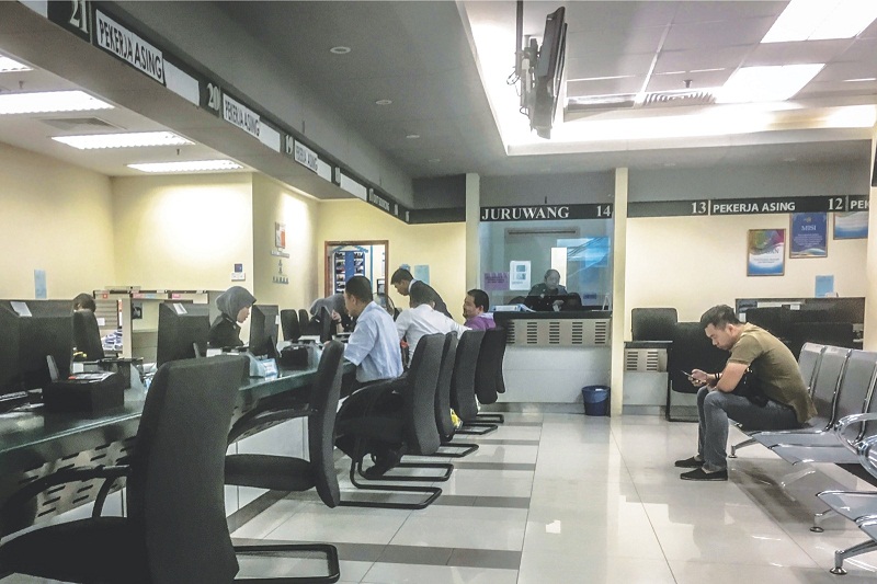 Employers still turn up at counters to enquire about foreign workers application submissions. u00e2u20acu201d Picture by Hari Anggara