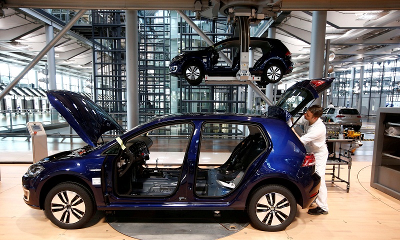 A worker assembles an e-Golf electric car at the production line of the Transparent Factory of Volkswagen in Dresden, Germany, March 30, 2017. u00e2u20acu201d Reuters pic