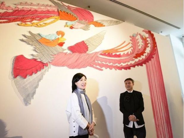Ran Hwang with senior assistant director of the Asian Civilisations Museum, Bernard Tan. They are seen with Hwang's phoenixes, which are made of 5km of coloured thread. — Asian Civilisations Museum handout via TODAY