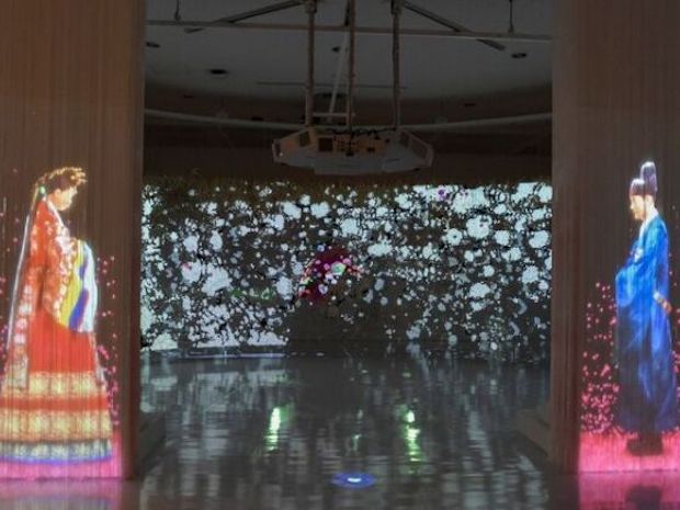 Ran Hwang's bride and groom seem to walk towards each other, as plum blossoms fall around them. — Asian Civilisations Museum handout via TODAY