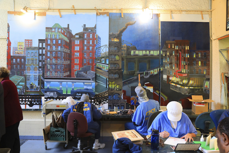 Prisoners work next to sections of a mural project at the state prison in San Quentin, California, January 23, 2017. — Picture by Jim Wilson/The New York Times