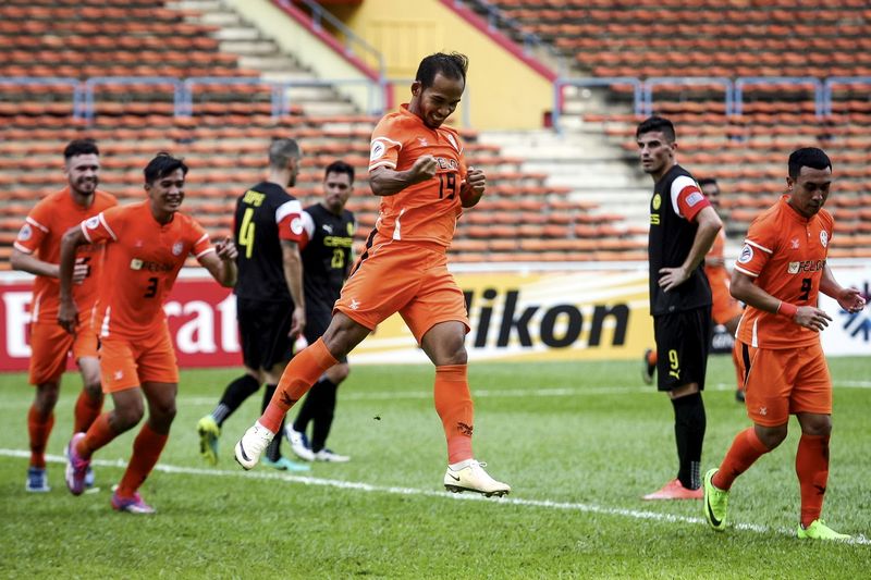 Felda Unitedu00e2u20acu2122s Mohamad Fazrul Hazli (centre) celebrates his goal during the AFC Cup 2017 Group G match at Stadium Shah Alam April 4, 2017. They beat Ceres Negros FC 3-0. u00e2u20acu201d Bernama pic