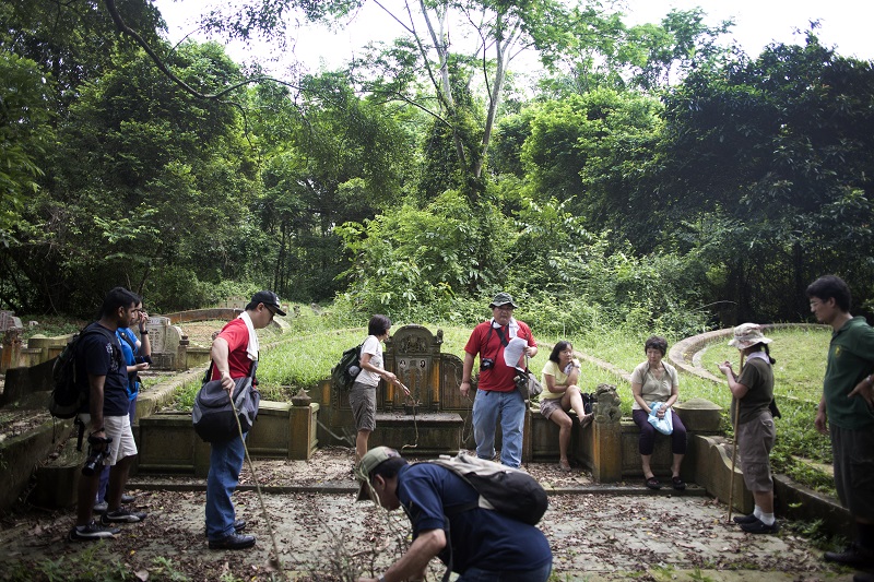 A public tour of Bukit Brown, one of the world’s largest Chinese cemeteries, in Singapore, June 3, 2012. Desperate for land, the government plans to level the cemetery eventually, but a group is working to preserve it. — Picture by Sim Chi Yin/The New York Times