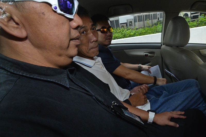 Yeo Liang Chai (centre) has been charged with setting alight a storeroom at St Hilda's Church on the morning of April 16, 2017. u00c2u00a0u00e2u20acu201d Picture by Robin Choo/TODAY