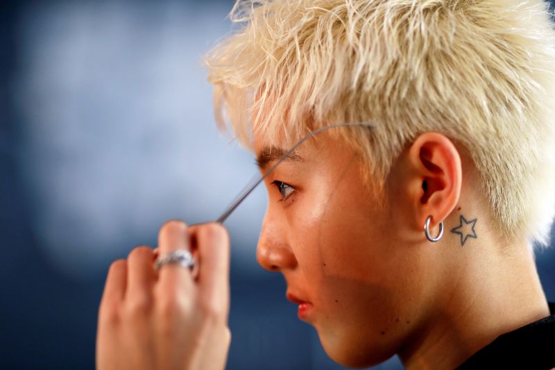 A member of China's all-girl u00e2u20acu02dcboybandu00e2u20acu2122 FFC-Acrush prepares for band's maiden press conference in Beijing, China April 28, 2017. u00e2u20acu201d Reuters pic