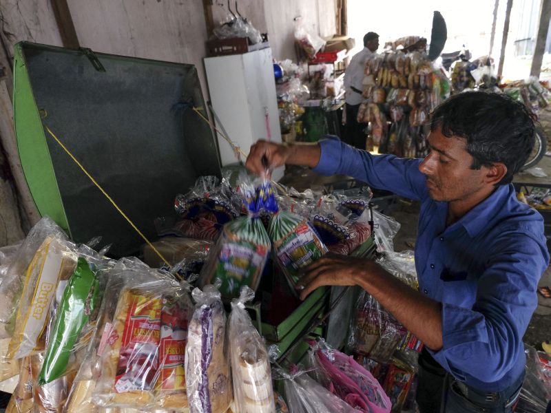 A man restocks breads and snacks on his motorcycle before selling them at the streets in Kuala Lumpur April 13, 2017. u00e2u20acu2022 Picture  by Yusof Mat Isa