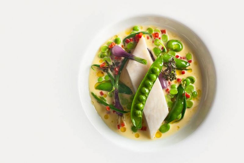 Turbot poached with garden pea nage and lemon thyme at Eleven Madison Park.