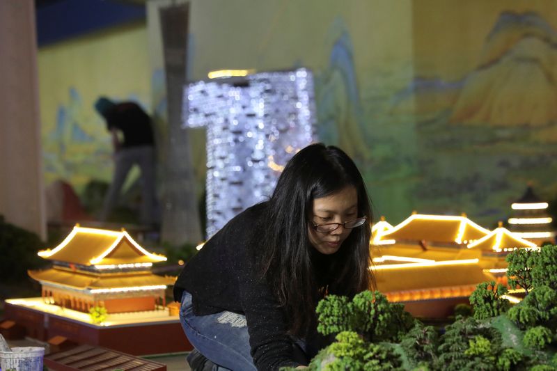 An artist works on a scene at Gulliver's Gate, a miniature world designed in a 49,000-square-foot exhibit space at Times Square, before it opens in New York April 3, 2017. u00e2u20acu201d Reuters pic