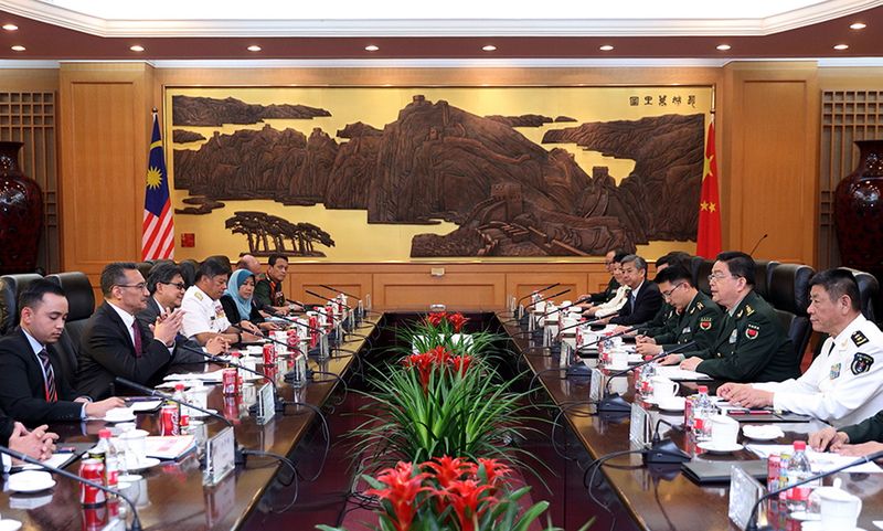 Defence Minister Datuk Seri Hishammuddin Hussein (left) leading the Malaysian delegation at a meeting with the Chinau00e2u20acu2122s Defence Minister General Chang Wanquan (second right) at the Chinese Defence Ministry in Beijing, April 23, 2017. u00e2u20acu201d Bernama pic