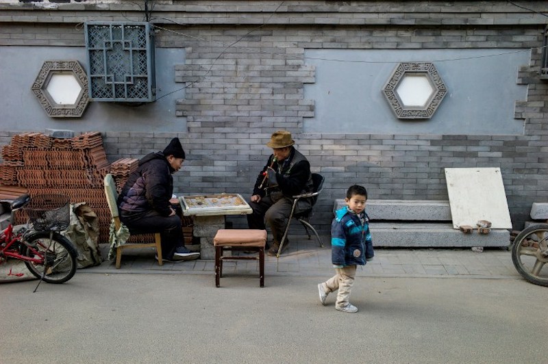 Men play Chinese chess in a hutong in Beijing November 28, 2016. — AFP pic